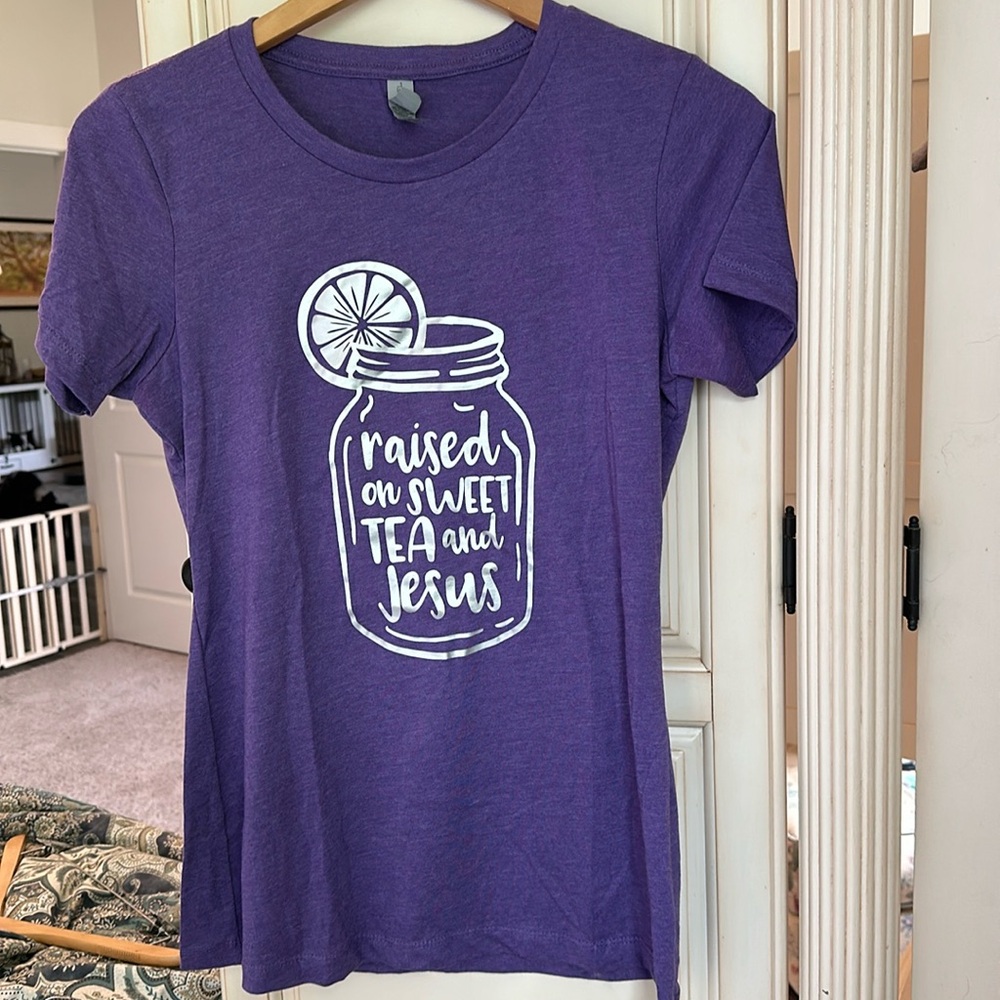 Purple t-shirt with adorable saying “Raised on sweet tea and Jesus” in silver.